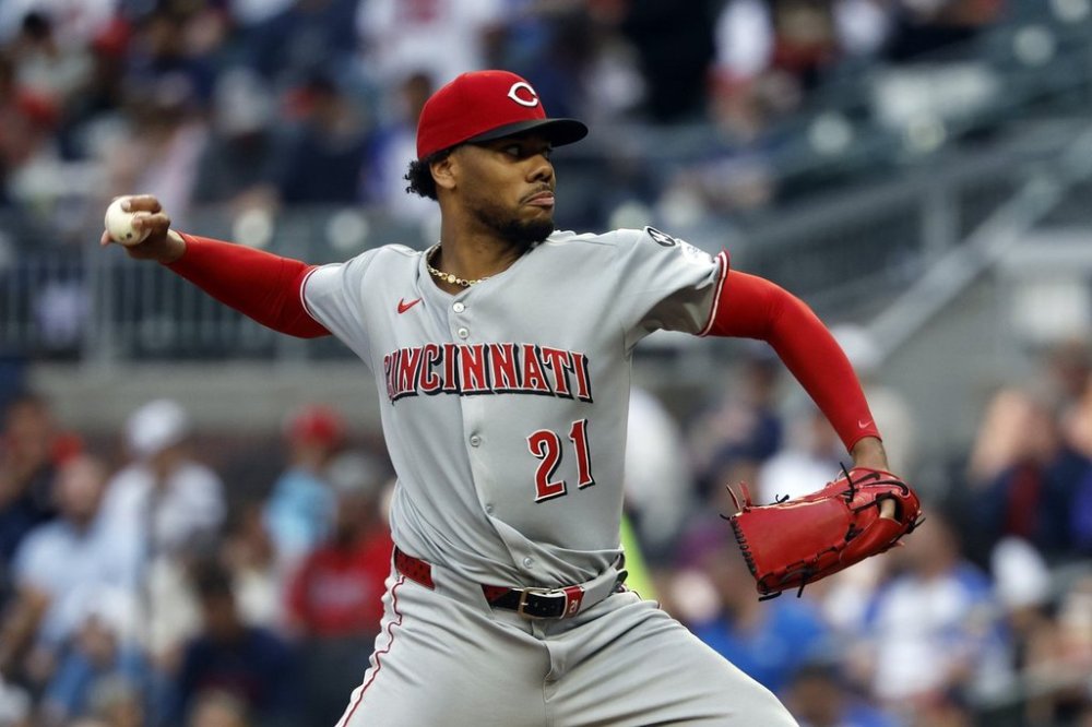 Cincinnati Reds' Hunter Greene pitches during the first inning of a baseball game against the Atlanta Braves, Wednesday, May 7, 2025, in Atlanta. (AP Photo/Butch Dill)