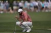 Scottie Scheffler lines up a putt on the 16th green during the second round of the RBC Heritage golf tournament, Friday, April 18, 2025, in Hilton Head Island, S.C. (AP Photo/Mike Stewart)