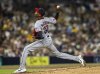 Cleveland Guardians relief pitcher Triston McKenzie (24) throws in the seventh inning of a baseball game against a San Diego Padres batter, Monday, March 31, 2025, in San Diego. (AP Photo/Tony Ding)