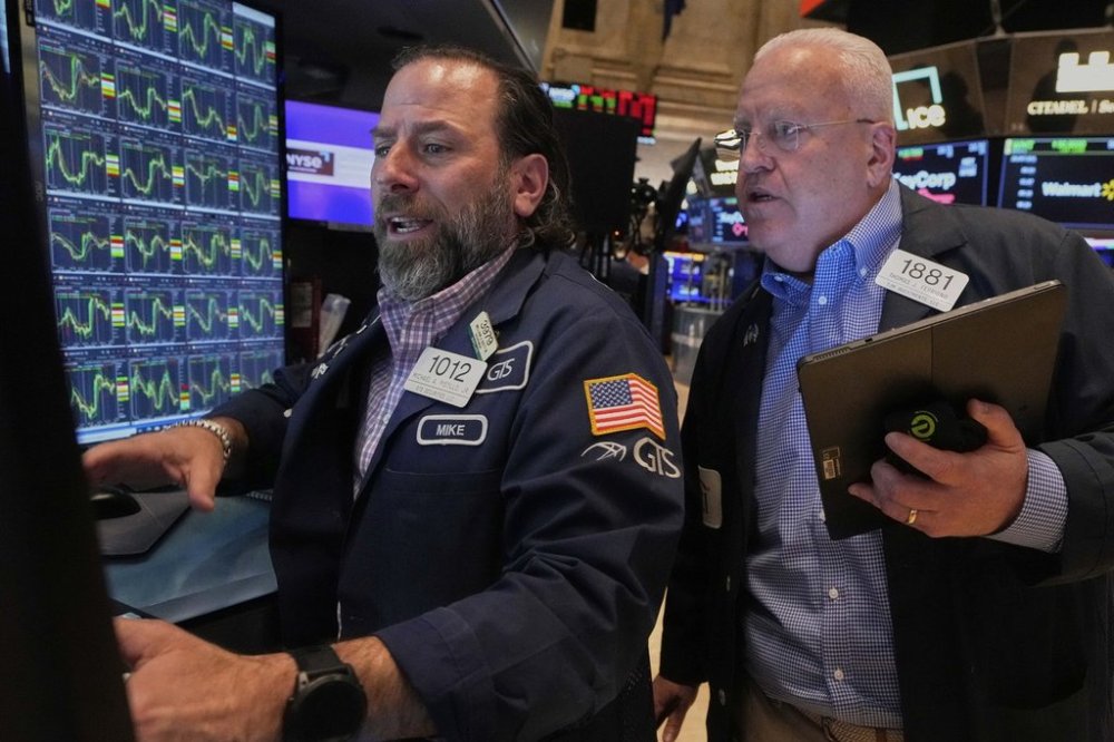 Specialist Michael Pistillo, left, and trader Thomas Ferrigno work on the floor of the New York Stock Exchange, Thursday, April 10, 2025. (AP Photo/Richard Drew)
