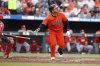 Baltimore Orioles' Ramon Laureano hits a home run in the seventh inning of a baseball game against the Cincinnati Reds, Saturday, April 19, 2025, in Baltimore. (AP Photo/Alyssa Howell)