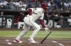 Arizona Diamondbacks' Pavin Smith hits a single against the Tampa Bay Rays in the first inning during a baseball game, Tuesday, April 22, 2025, in Phoenix. (AP Photo/Rick Scuteri)