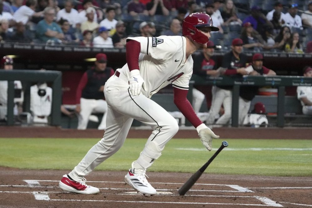 Arizona Diamondbacks' Pavin Smith hits a single against the Tampa Bay Rays in the first inning during a baseball game, Tuesday, April 22, 2025, in Phoenix. (AP Photo/Rick Scuteri)