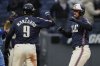 Cleveland Guardians' Gabriel Arias, right, celebrates with teammate Kyle Manzardo (9) after hitting a home run in the fourth inning of a baseball game against the Kansas City Royals in Cleveland, Friday, April 11, 2025. (AP Photo/Sue Ogrocki)