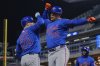 New York Mets' Juan Soto (22) celebrates with Pete Alonso (20) after hitting a two-run home run during the seventh inning of a baseball game against the Minnesota Twins, Monday, April 14, 2025, in Minneapolis. (AP Photo/Abbie Parr)