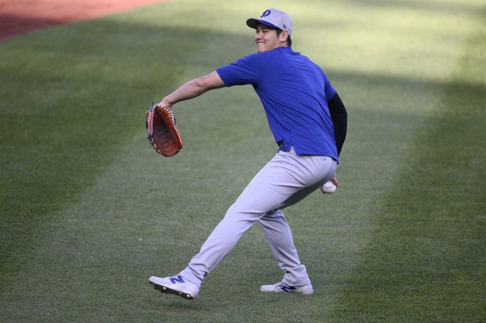 Los Angeles Dodgers' Shohei Ohtani works out before a baseball game against the Washington Nationals, Tuesday, April 8, 2025, in Washington. (AP Photo/Nick Wass)