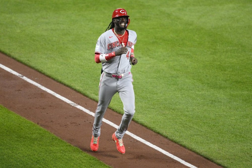 Cincinnati Reds' Elly De La Cruz, right, celebrates his three-run home run during the third inning of a baseball game against the Baltimore Orioles, Friday, April 18, 2025, in Baltimore. (AP Photo/Nick Wass)