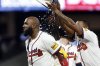 Atlanta Braves designated hitter Marcell Ozuna (left) is doused with water by Raisel Iglesias (right) after hitting a walk off RBI during the10th inning of a baseball game to beat the Cincinnati Reds, Tuesday, May 6, 2025, in Atlanta. (AP Photo/Butch Dill)
