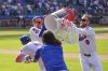New York Mets' Tyrone Taylor, second from left, and Brandon Nimmo (9), right, try to douse Starling Marte, left, after he hit a walk off single during the tenth inning of a baseball game against the Philadelphia Phillies, Wednesday, April 23, 2025, in New York. (AP Photo/Seth Wenig)