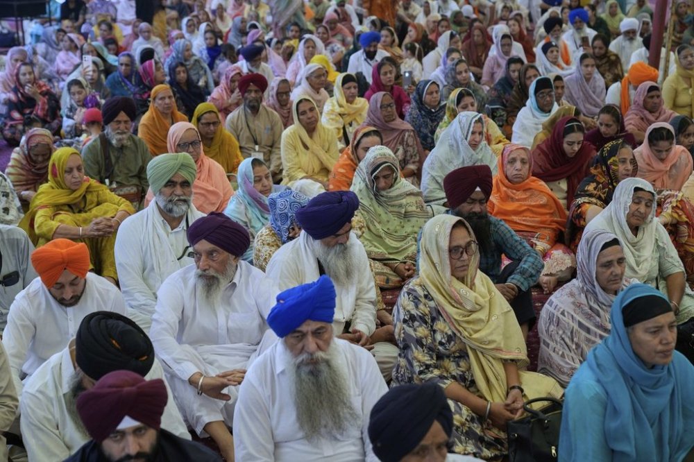 Sikh pilgrims attend a ceremony to mark the Vaisakhi festival at the shrine of Gurdwara Janam Asthan in Nankana Sahib, some 75 kilometres (46 miles) west of Lahore, Pakistan, Monday, April 14, 2024. (AP Photo/K.M. Chaudary)