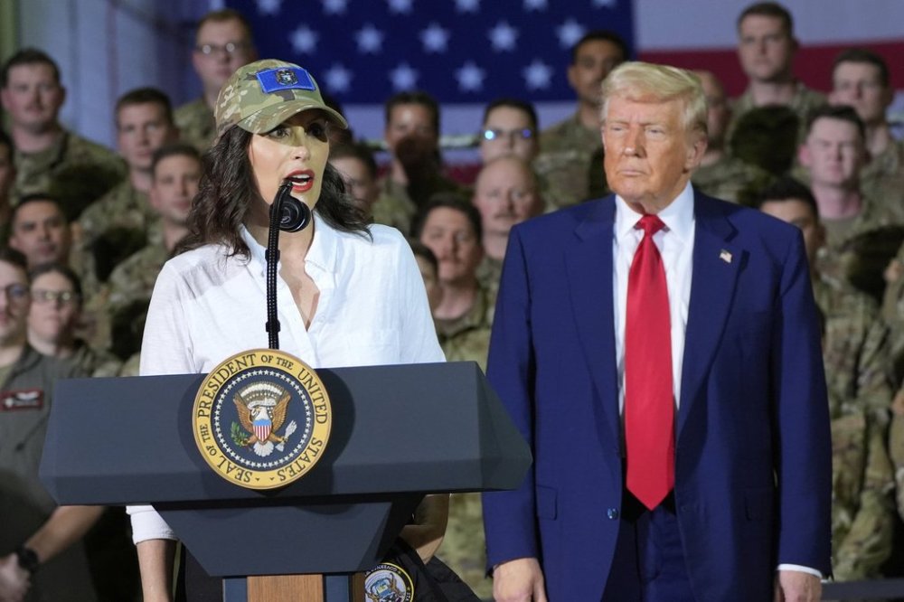President Donald Trump listens as Michigan Gov. Gretchen Whitmer speaks to members of the Michigan National Guard at Selfridge Air National Guard Base, Tuesday, April 29, 2025, in Harrison Township, Mich. (AP Photo/Alex Brandon)