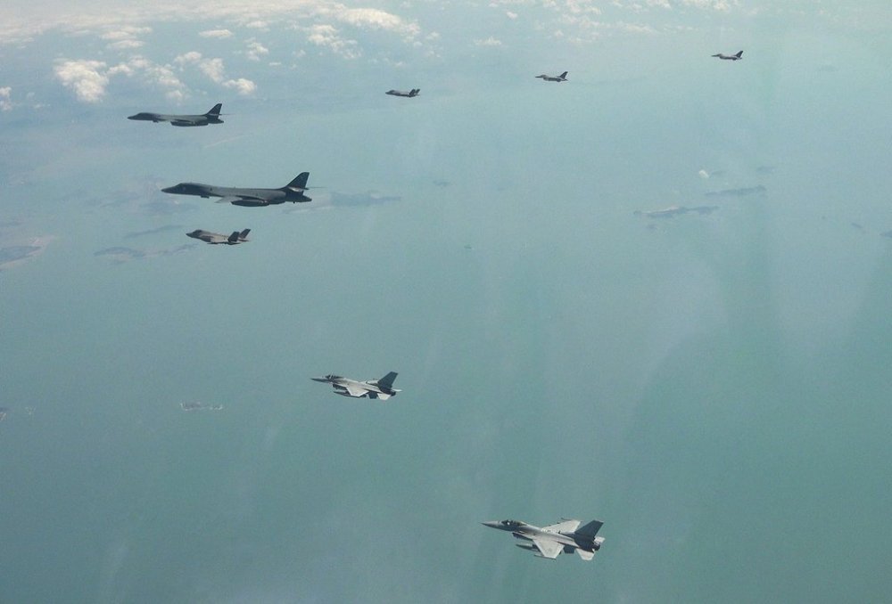 In this photo, provided by South Korea Air Force, two U.S. Air Force B-1B bomber, top left, fly over the Korean Peninsula with South Korean Air Force F-35A fighter jet, F-16 fighter jets and U.S. Air Force F-16 fighter jets in South Korea during the joint aerial drills of South Korea and the United States, at an undisclosed location in South Korea, Tuesday, April 15, 2025. (South Korea Air Force via AP)