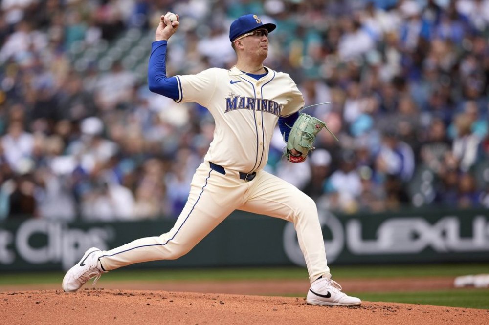 Seattle Mariners starting pitcher Logan Evens throws to a Miami Marlins batter in his major league debut during the second inning of a baseball game, Sunday, April 27, 2025, in Seattle. (AP Photo/John Froschauer)
