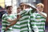 Celtic's Adam Idah, center, celebrates scoring their side's first goal of the game with teammates during the Scottish Premiership soccer match between Rangers and Celtic at Ibrox Stadium, Glasgow, Scotland, Sunday, May 4, 2025. (Steve Welsh/PA via AP)