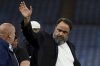 FILE - Olympiacos club owner Evangelos Marinakis walks on the pitch at the end of the Europa Conference League semifinal, first leg, soccer match between Aston Villa and Olympiacos at Villa Park in Birmingham, England, (AP Photo/Rui Vieira, file)
