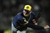 Milwaukee Brewers pitcher Craig Yoho follows through on his throw to a San Francisco Giants batter during the eighth inning of a baseball game Monday, April 21, 2025, in San Francisco. (AP Photo/Godofredo A. Vásquez)