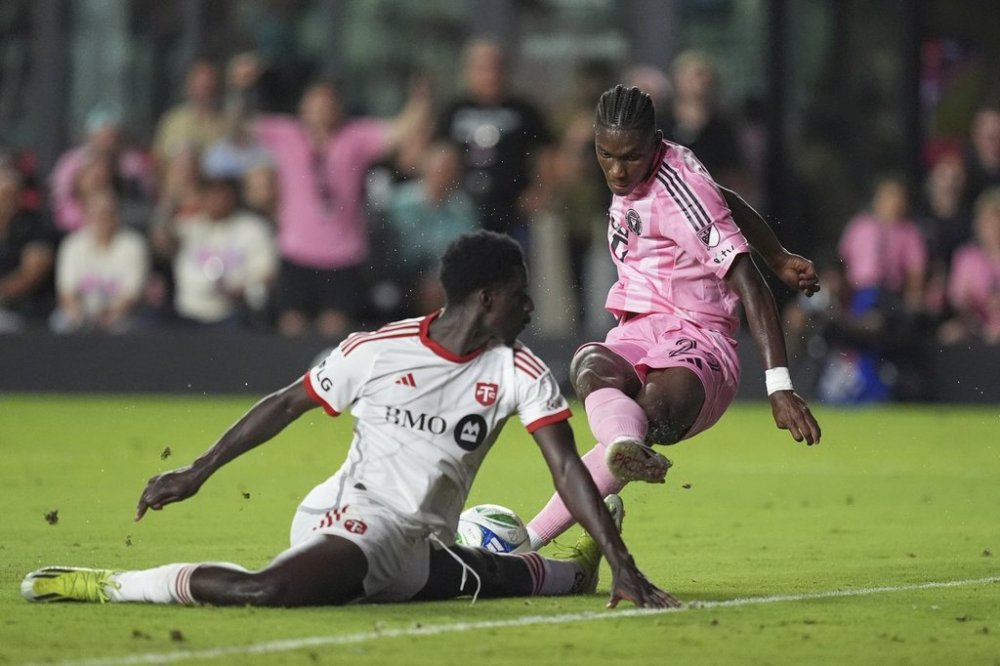 A scoring attempt by Inter Miami forward Allen Obando is blocked by Toronto FC defender Nicksoen Gomis (15) during the second half of an MLS soccer match, Sunday, April 6, 2025, in Fort Lauderdale, Fla. (AP Photo/Rebecca Blackwell)