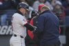 Cleveland Guardians' Lane Thomas, left, is checked out after being hit by a pitch in the fifth inning of a baseball game against the Chicago White Sox in Cleveland, Tuesday, April 8, 2025. (AP Photo/Sue Ogrocki)