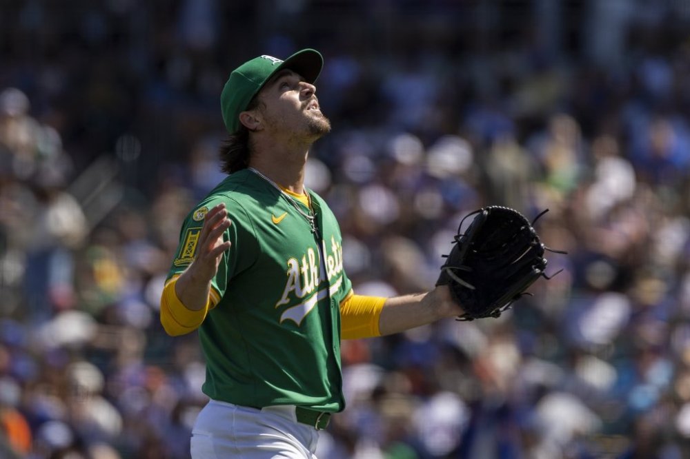 Athletics pitcher J.T. Ginn (70) looks to the sky as he leaves the mound during the sixth inning of a baseball game against the New York Mets Saturday, April 12, 2025, in West Sacramento, Calif. (AP Photo/Sara Nevis)