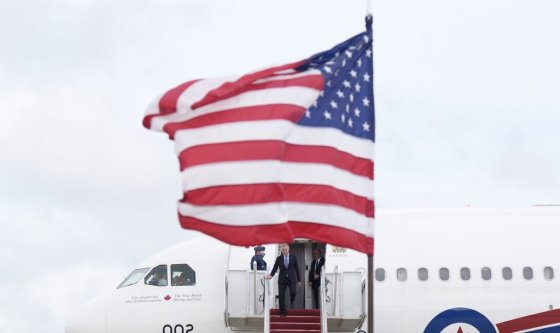 Prime Minister Mark Carney disembarks a government plane as he arrives in Washington, D.C., Monday. (Adrian Wyld / The Canadian Press)