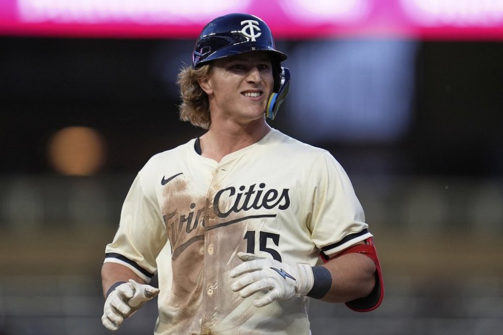 Minnesota Twins' Luke Keaschall (15) reacts after hitting a single during the fifth of a baseball game against the Chicago White Sox, Tuesday, April 22, 2025, in Minneapolis. (AP Photo/Abbie Parr)