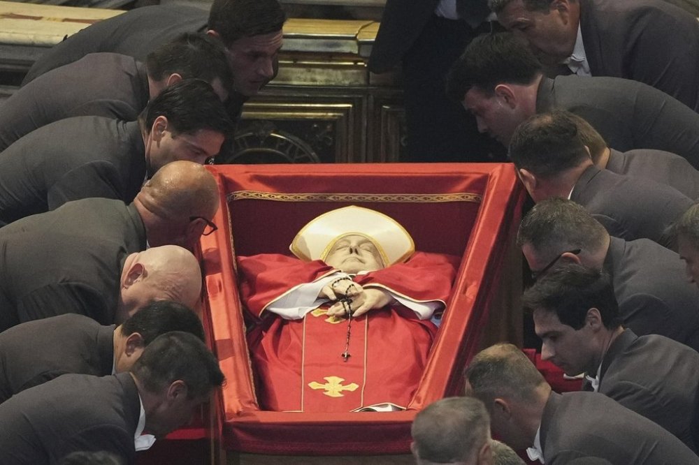The body of Pope Francis is placed into St. Peter's Basilica at the Vatican, Wednesday, April 23, 2025, where he will lie in state for three days. (AP Photo/Andrew Medichini, Pool)