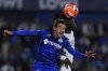 Getafe's Luis Milla, left, and Real Madrid's Eduardo Camavinga challenge for the ball during a Spanish La Liga soccer match between Getafe and Real Madrid at the Coliseum Alfonso Perez stadium in Getafe, Spain, Wednesday, April 23, 2025. (AP Photo/Manu Fernandez)