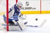 Winnipeg Jets goaltender Connor Hellebuyck blocks a shot by the Dallas Stars during the first period of an NHL hockey game Thursday, April 10, 2025, in Dallas. (AP Photo/Julio Cortez)