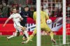 Hertha's Ibrahim Maza, centre, shoots at the goal of Cologne goalkeeper Marvin Schwäbe during the Bundesliga 2 soccer match between FC Koln and Hertha BSC, at the RheinEnergieStadion in Cologne, Germany, Saturday April 5, 2025. (Marius Becker/dpa via AP)