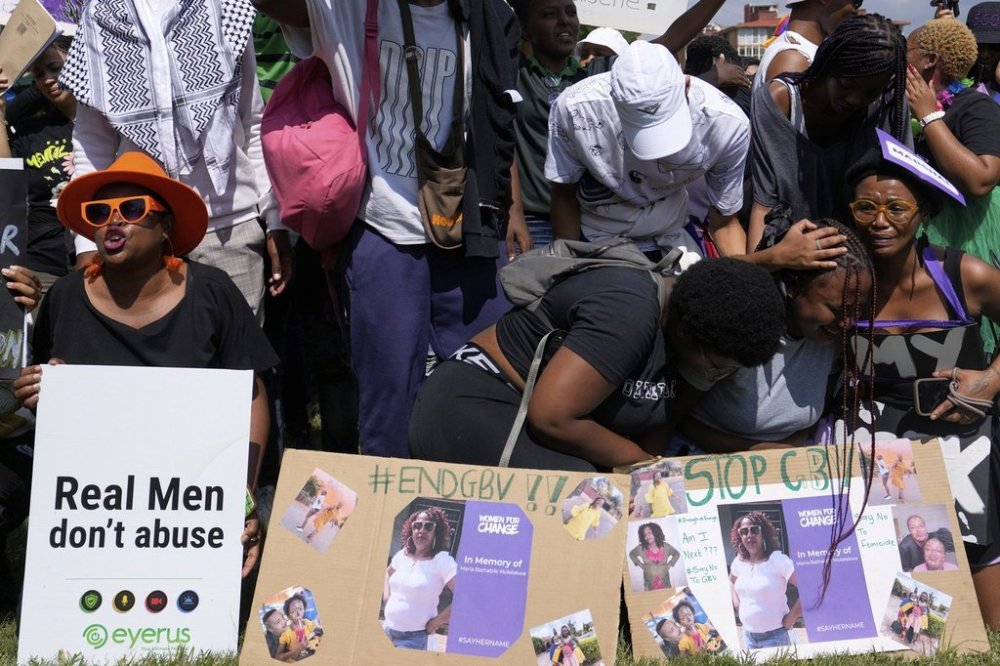 Activists chant slogans during the women's protest and hand over of a petition demanding that gender-based violence and femicide be declared a national disaster, at the Union Buildings in Pretoria, South Africa, Friday, April 11, 2025. (AP Photo/Themba Hadebe)