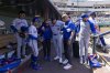 New York Mets outfielder Jose Siri (19) is helped out of the dugout after an injury at-bat during the second inning of a baseball game against the Athletics Saturday, April 12, 2025, in West Sacramento, Calif. (AP Photo/Sara Nevis)