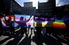 Counter-protesters hold LGBTQ+ flags as a rally against sexual orientation and gender identity programs in schools takes place in Ottawa, on Wednesday, Sept. 20, 2023. THE CANADIAN PRESS/Justin Tang