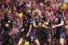 Lyon's Melchie Dumornay, Alice Sombath, Lindsey Heaps, Kadidiatou Diani and Vanessa Gilles, from left, react after Diani scored the opening goal during the women's Champions League semifinals, first leg, soccer match between Arsenal FC and Olympique Lyonnais at the Arsenal Stadium, in London, Saturday, April 19, 2025. (AP Photo/Kirsty Wigglesworth)