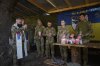 In this photo provided by Ukraine's 93rd Kholodnyi Yar Separate Mechanized Brigade press service, Ukrainian servicemen attend an Easter service on their position in the Donetsk region, Ukraine, Sunday, April 20, 2025. (Mykola Oliinyk/Ukraine's 93rd Mechanized Brigade via AP)