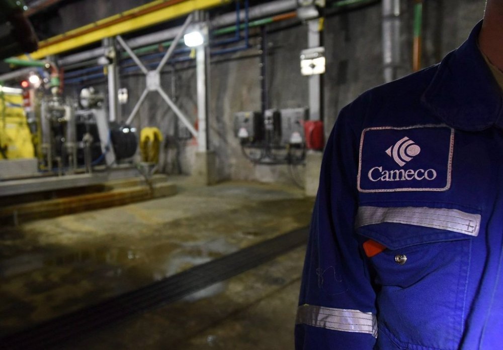 Cameco Corp. reported a first-quarter profit as its revenue rose compared with a year ago, citing strong production of uranium and fuel services. A patch is seen on an employee during a Cameco media tour of the uranium mine in Cigar Lake, Wednesday, Sept. 23, 2015. THE CANADIAN PRESS/Liam Richards