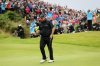 FILE - Ireland's Shane Lowry reacts after getting a birdie on the fourth green during the final round of the British Open Golf Championships at Royal Portrush in Northern Ireland, Sunday, July 21, 2019. (AP Photo/Peter Morrison, File)