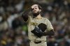 San Diego Padres pitcher Dylan Cease wipes his face during the third inning of a baseball game against the Athletics, Tuesday, April 8, 2025, in West Sacramento, Calif. (AP Photo/Godofredo A. Vásquez)