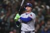 Texas Rangers' Joc Pederson strikes out against the Seattle Mariners during the sixth inning of a baseball game Saturday, April 12, 2025, in Seattle. (AP Photo/Lindsey Wasson)