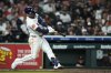 Houston Astros' Christian Walker (8) hits a home run during the sixth inning of a baseball game against the San Diego Padres in Houston, Saturday, April 19, 2025. Isaac Paredes also scored. (AP Photo/Ashley Landis)
