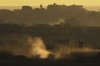 An Israeli army tank maneuvers in the Gaza Strip is seen from southern Israel, Sunday, May 4, 2025. (AP Photo/Ariel Schalit)