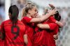 Bayern Munich's players celebrate their side's third goal during the German women's Soccer Cup final match between FC Bayern Munich and SV Werder Bremen in Cologne, Germany, Thursday, may 1, 2025. (Fabian Strauch/dpa via AP)