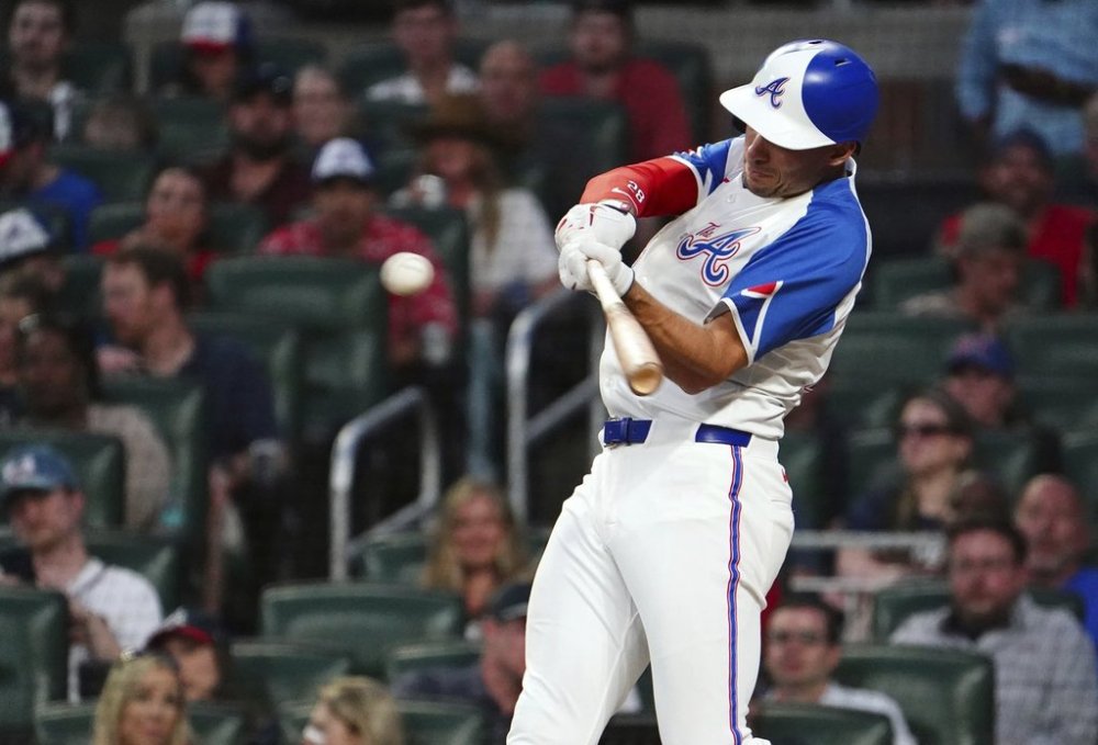 Atlanta Braves first base Matt Olson (28) hits a single against the Minnesota Twins during the third inning in a baseball game at Truist Park, Saturday, April 19, 2025, in Atlanta. (AP Photo/ John David Mercer)