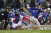 Texas Rangers Corey Seager (5) hits a home run during the first inning of a baseball game against the Chicago Cubs, Wednesday, April 9, 2025, in Chicago. (AP Photo/Erin Hooley)