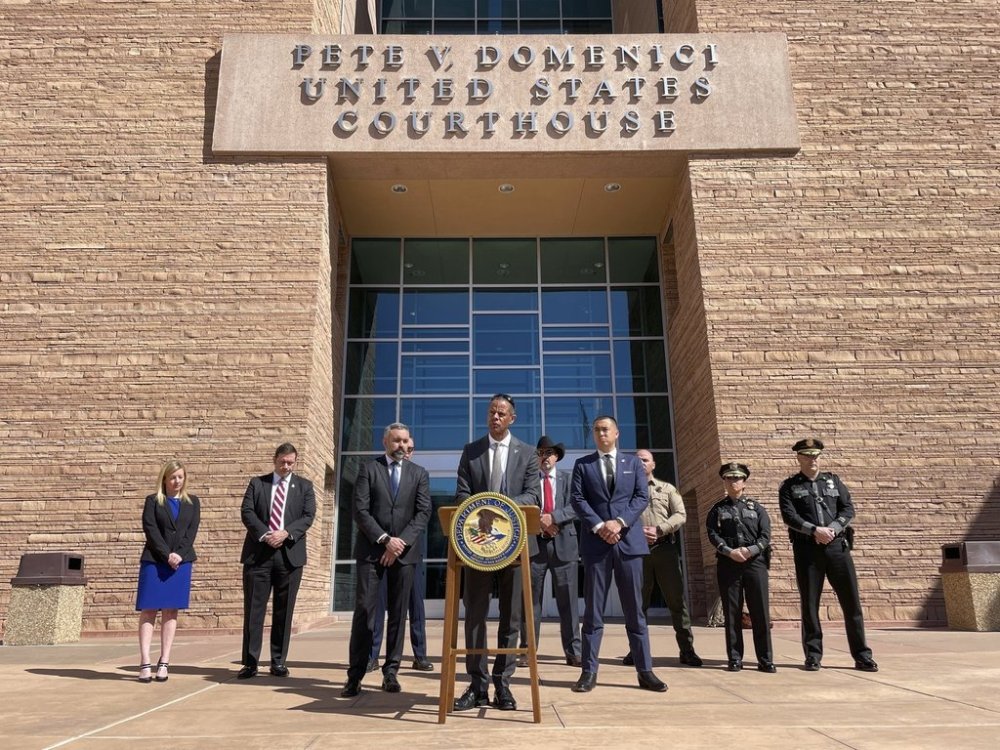FILE - New Mexico Department of Public Safety Secretary Jason Bowie stands at the podium flanked by state and federal officials as charges are announced in the March 15 killing of New Mexico State Police Officer Justin Hare, during a joint news conference in Albuquerque, N.M., on March 22, 2024. (AP Photo/Susan Montoya Bryan)