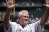 FILE - Former Colorado Rockies manager Clint Hurdle acknowledges the crowd as he is introduced before a baseball game against the Oakland Athletics, July 30, 2023, in Denver. (AP Photo/David Zalubowski, file)