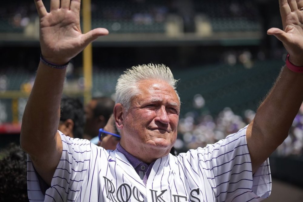 FILE - Former Colorado Rockies manager Clint Hurdle acknowledges the crowd as he is introduced before a baseball game against the Oakland Athletics, July 30, 2023, in Denver. (AP Photo/David Zalubowski, file)