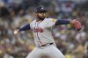 Atlanta Braves starting pitcher Reynaldo Lopez works against a San Diego Padres batter during the first inning of a baseball game Friday, March 28, 2025, in San Diego. (AP Photo/Gregory Bull)