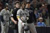 New York Yankees' Jazz Chisholm Jr., center, reacts after getting called out on strikes by home plate umpire John Bacon, left, during the seventh inning of a baseball game against the Tampa Bay Rays Thursday, April 17, 2025, in Tampa, Fla. (AP Photo/Chris O'Meara)