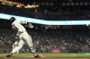 San Francisco Giants' Jung Hoo Lee hits an RBI triple during the seventh inning of a baseball game against the Milwaukee Brewers, Monday, April 21, 2025, in San Francisco. (AP Photo/Godofredo A. Vásquez)