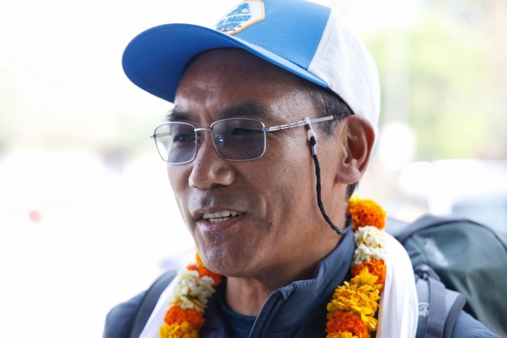 Renowned Sherpa mountain guide Kami Rita is garlanded at the Tribhuvan airport as he prepares to depart to ascend Mount Everest for the record 31st time, in Kathmandu, India, Sunday, April 20, 2025. (AP Photo/Gopen Rai)